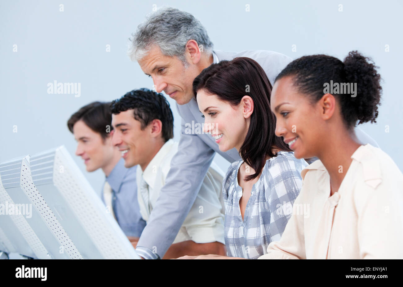 Confident mature manager checking his employee's work Stock Photo - Alamy
