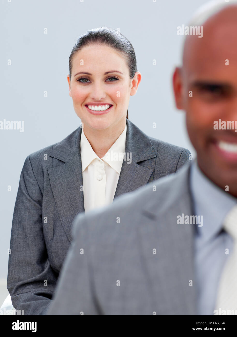 Young business people smiling Stock Photo - Alamy