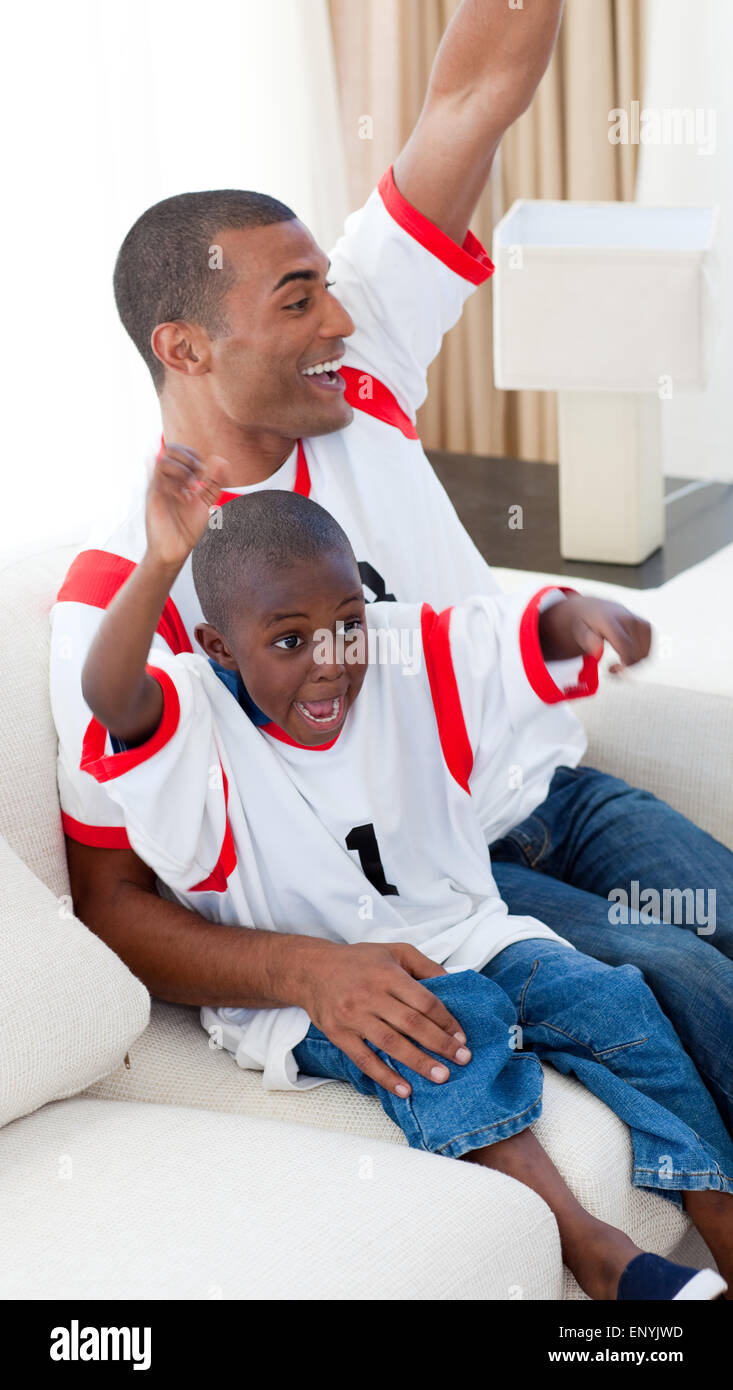 Happy father and his son celebrating a goal Stock Photo