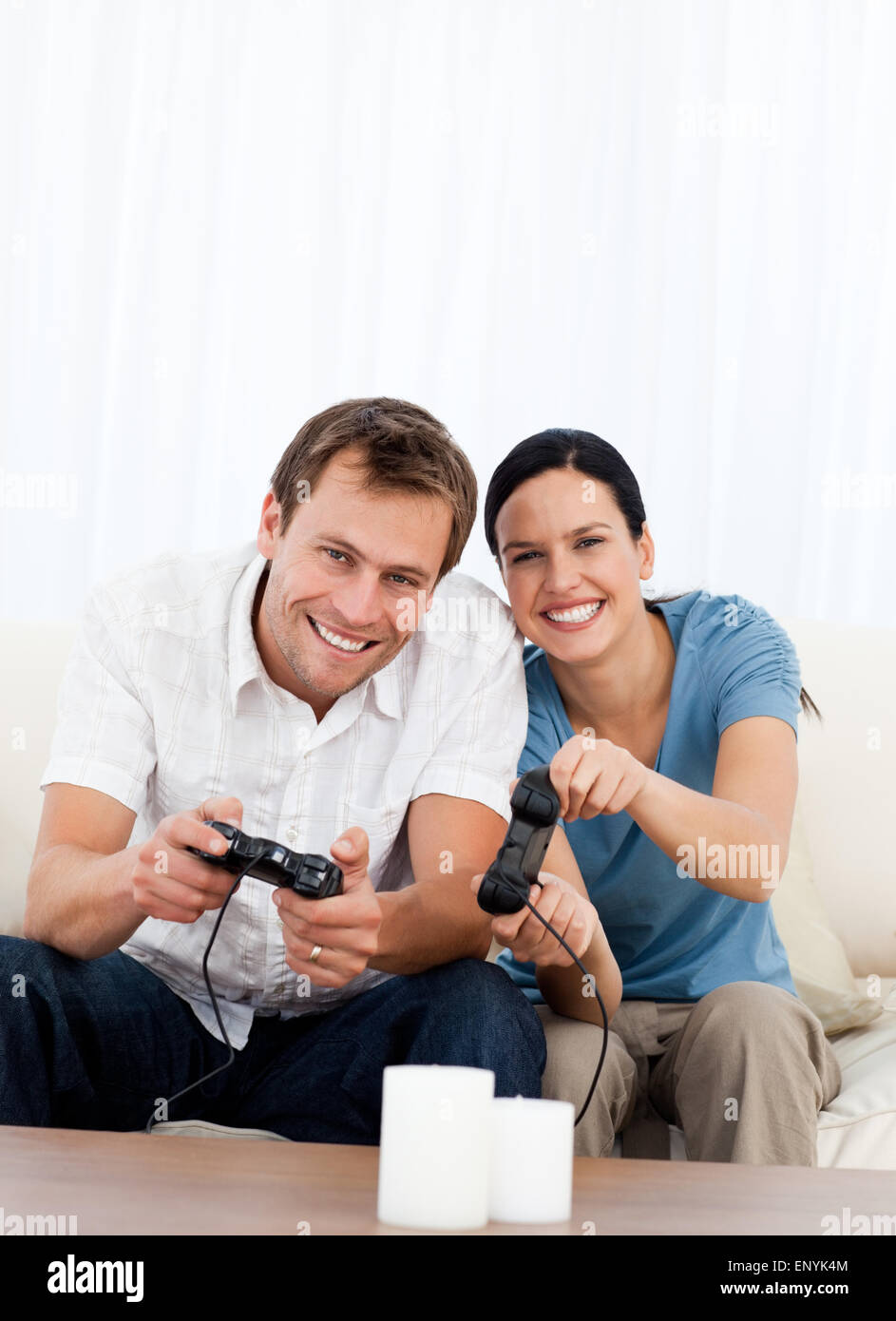 Excited couple playing video games hi-res stock photography and images ...