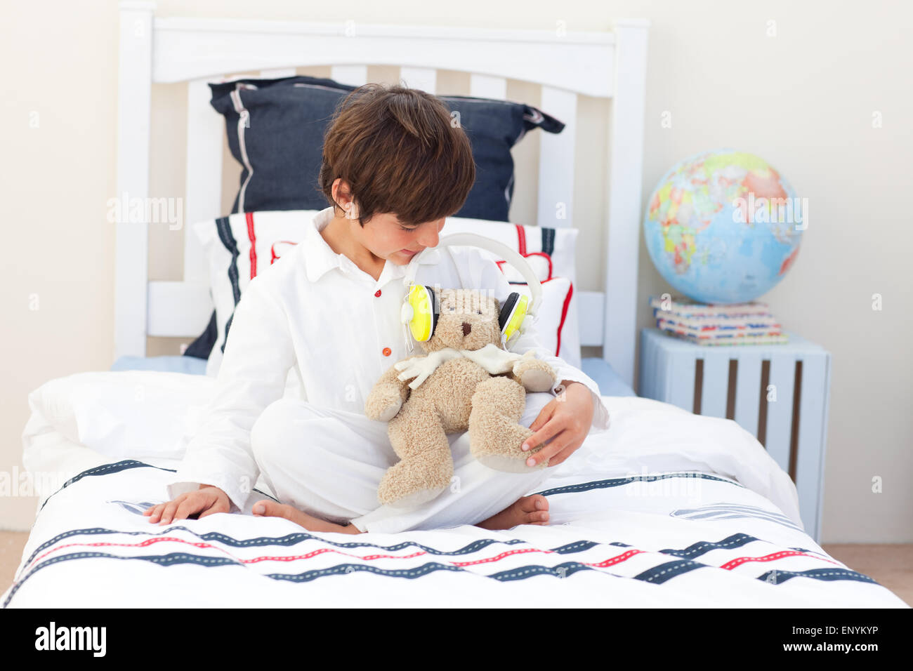 Adorable little boy playing with a teddy bear Stock Photo - Alamy