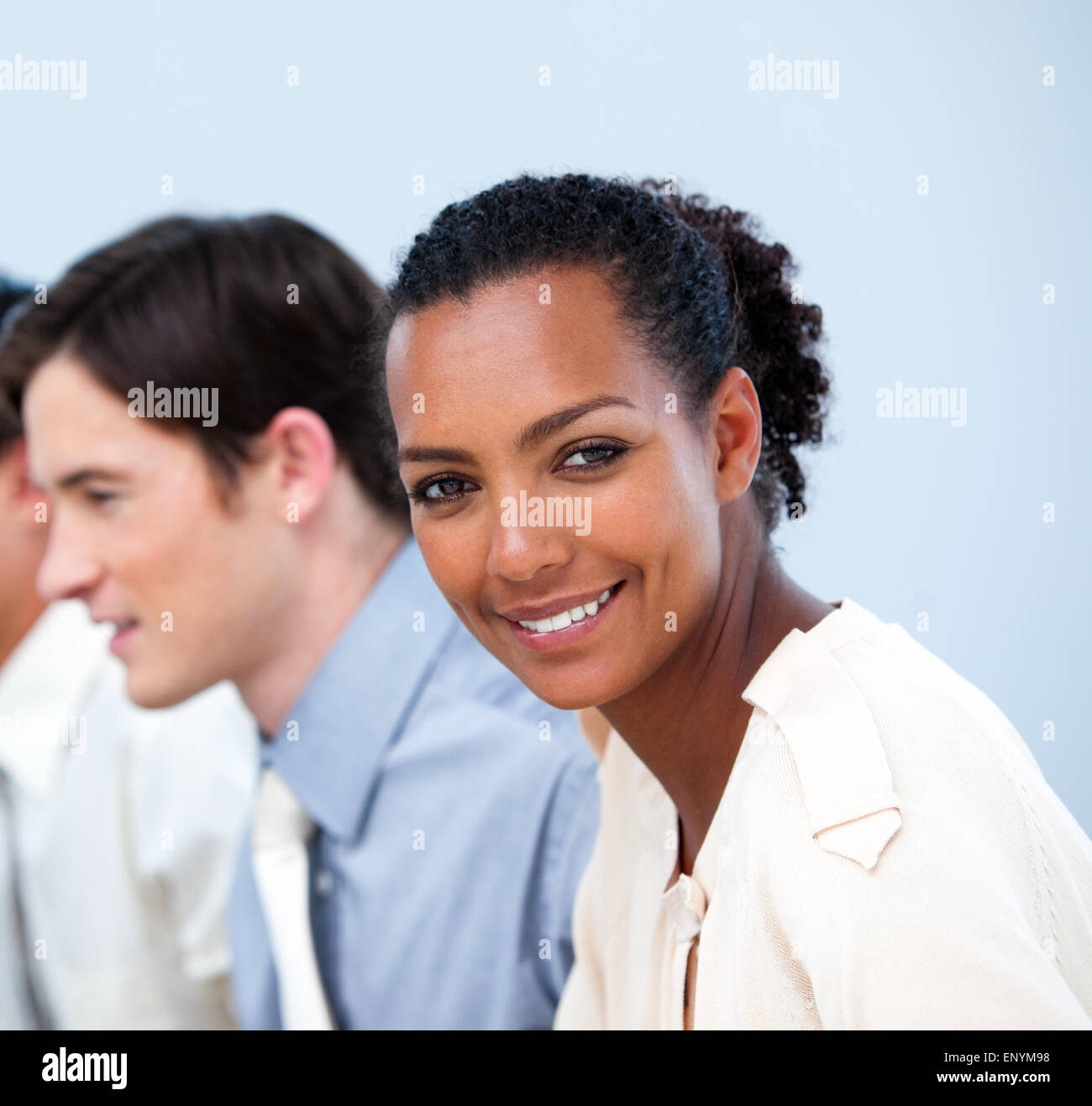 Smiling young business people at work Stock Photo - Alamy
