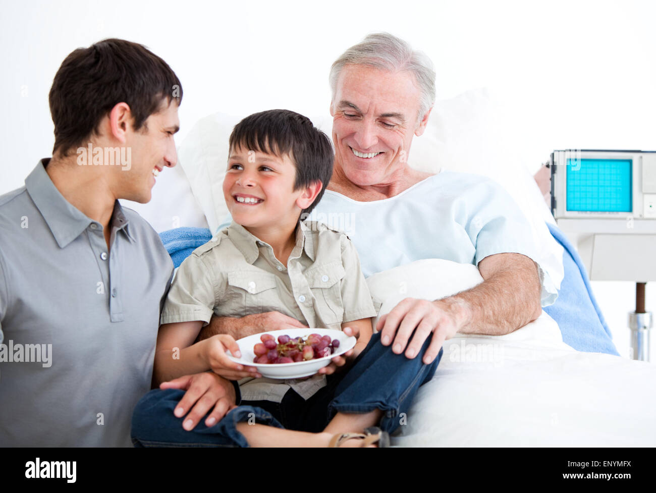 Smiling father and his son visiting grandfather Stock Photo - Alamy