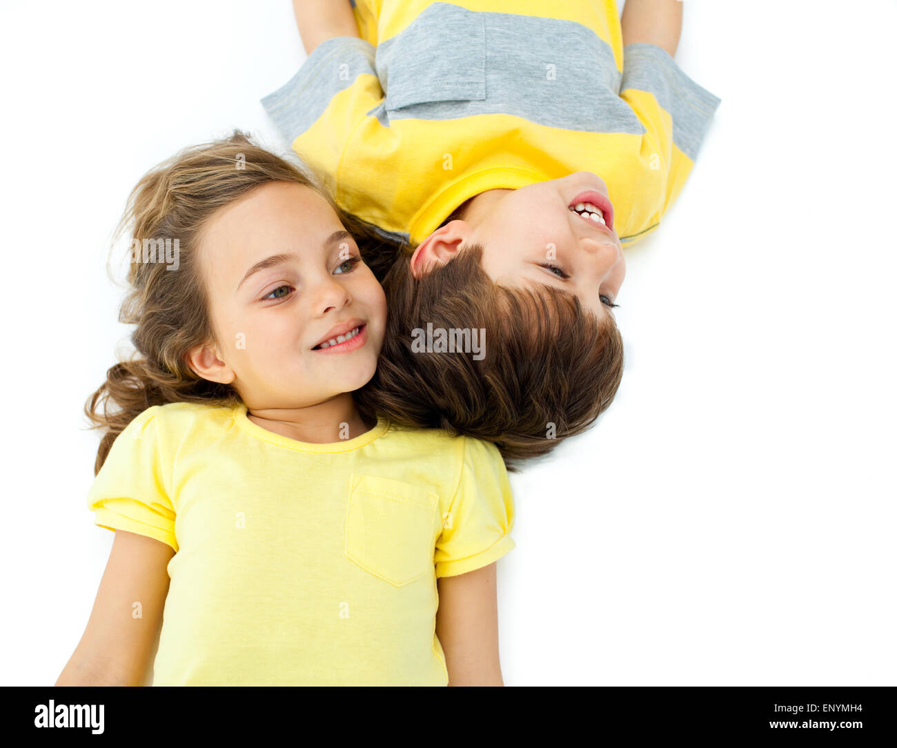 Cute children lying on the floor Stock Photo Alamy
