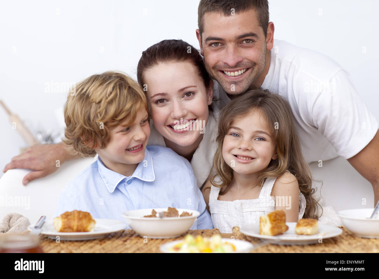 Happy family having breakfast Stock Photo - Alamy