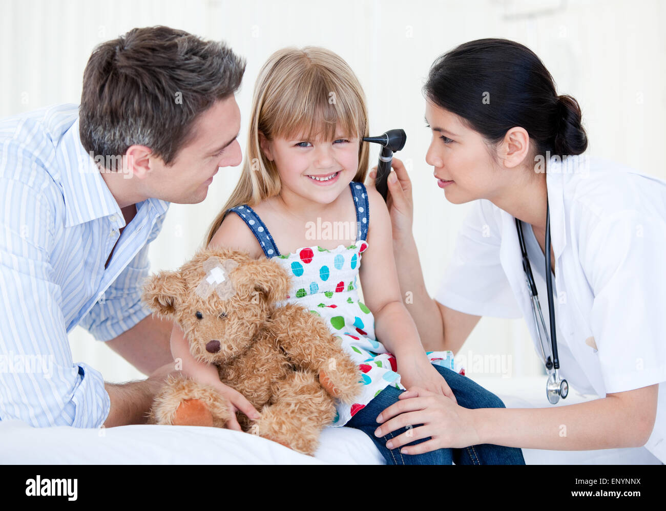 Smiling girl looks happy with her teddy bear Stock Photo - Alamy