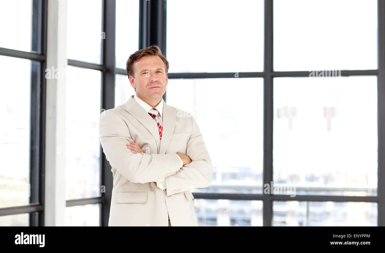 Business leader with folded arms looking at the camera Stock Photo - Alamy
