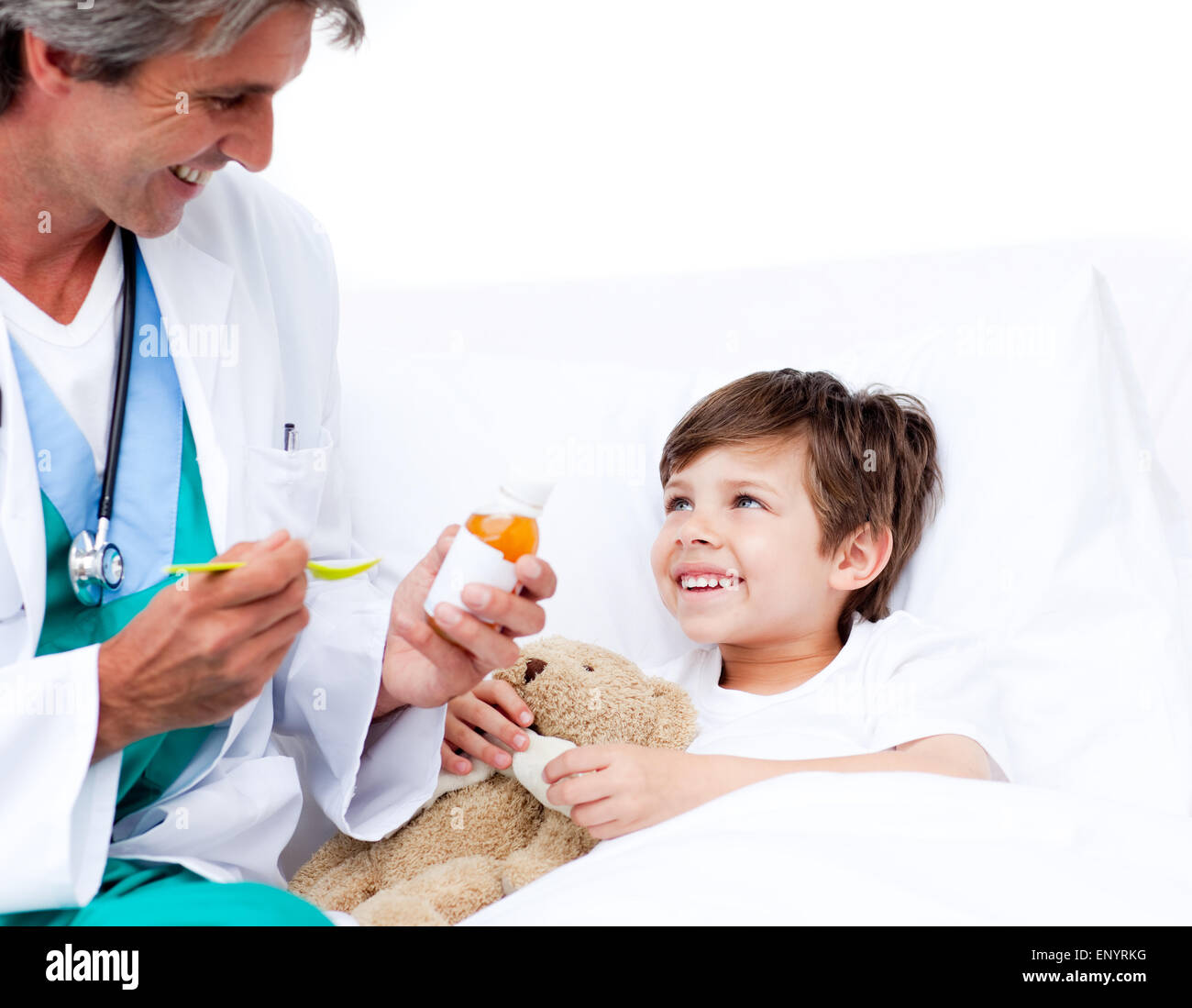 Smiling little boy taking cough medicine Stock Photo Alamy