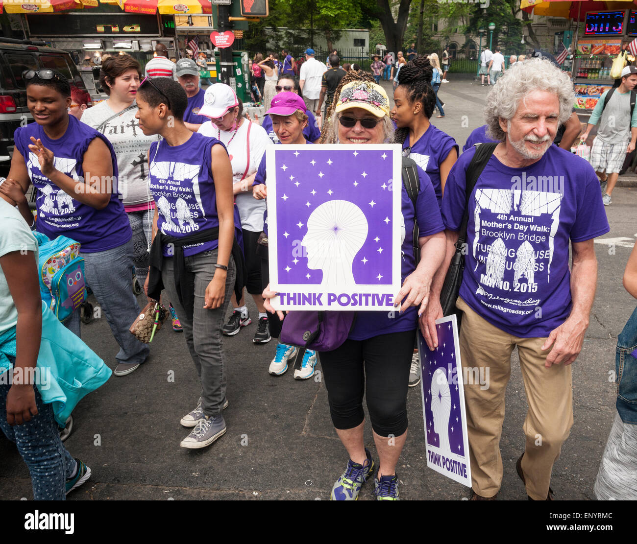 Members and supporters of the group Milagros Day Worldwide participate in their Mother's Day Walk against domestic violence starting at City Hall in New York on Mother's Day, Sunday, May 10, 2015. Several hundred men, women and children, some of them victims,  participated in their warm up pep rally and walked across the bridge to raise money and awareness for the victims of domestic violence. (© Richard B. Levine) Stock Photo