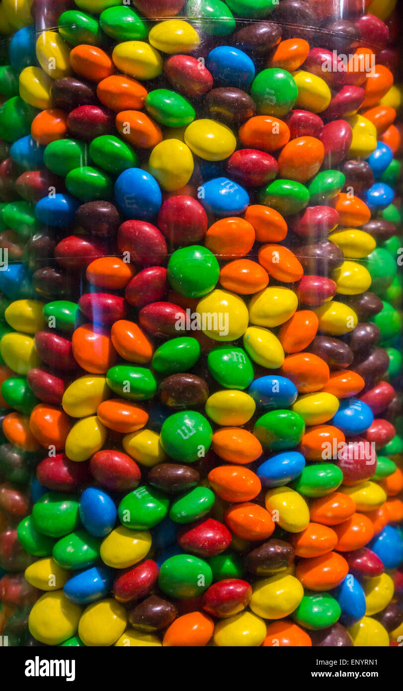 An assortment of M&M candies in different colors are seen in New York on Friday, May 8, 2015. Mars Inc, the maker of M&M's, Snickers, Twix and Wrigley's announced that it would support a U.S. government plan to have candy packaging reveal added sugars on their nutritional content labels. Added sugars are sugars and syrups used in the processing of food as opposed to natural sugars found in fruit.  (© Richard B. Levine) Stock Photo