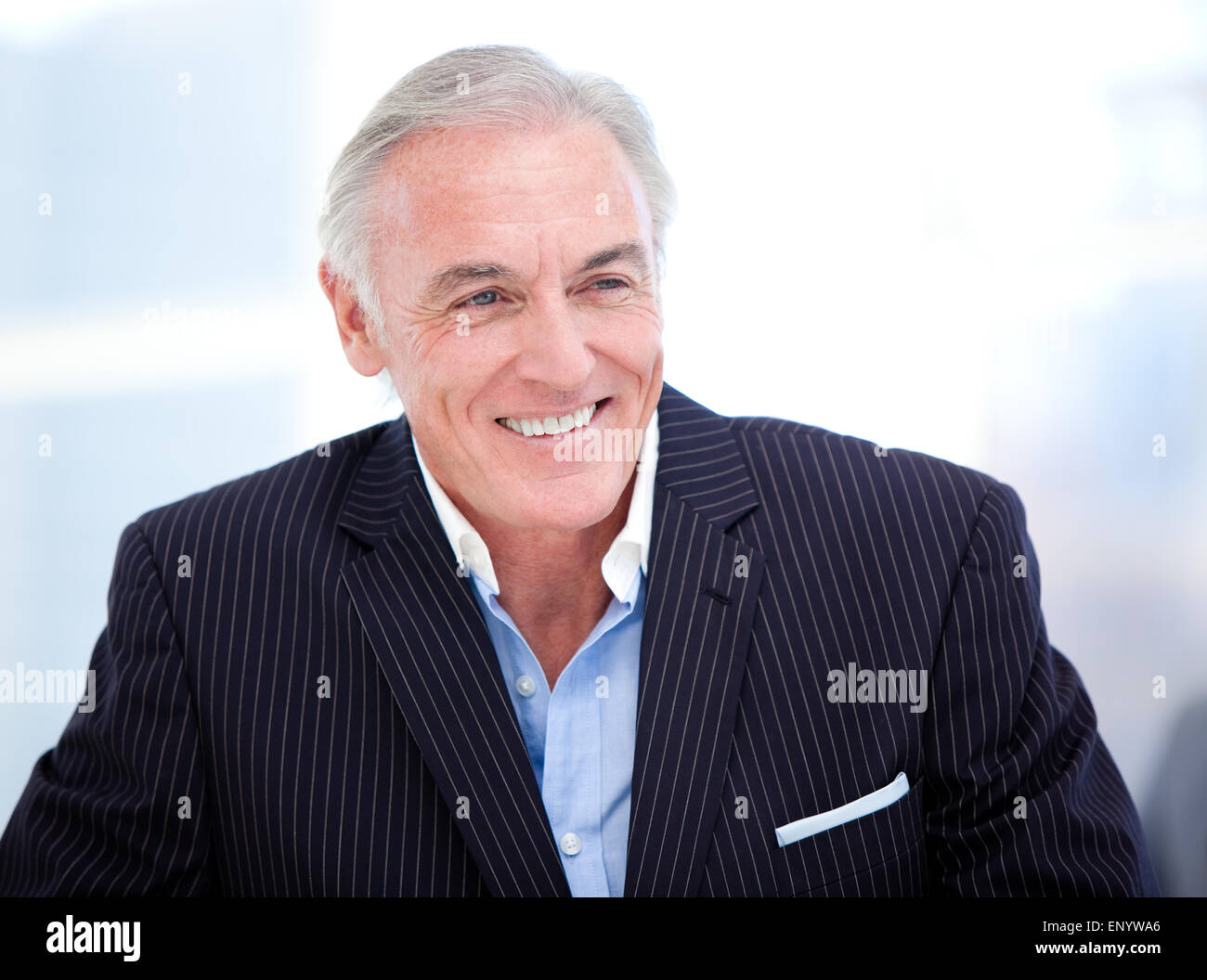 Portrait of a cheerful senior businessman smiling Stock Photo - Alamy