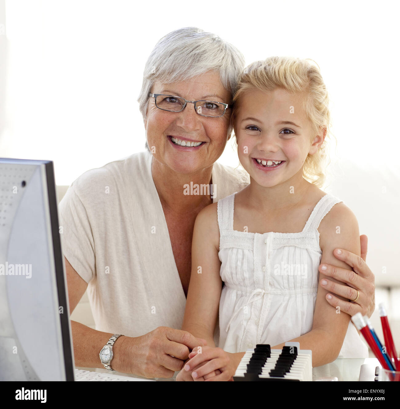 Portrait of granddaughter and grandmother using a computer Stock Photo ...