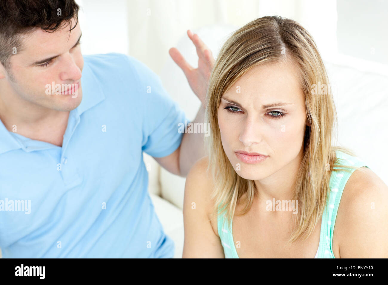 Young couple having an argue in the living-room Stock Photo - Alamy