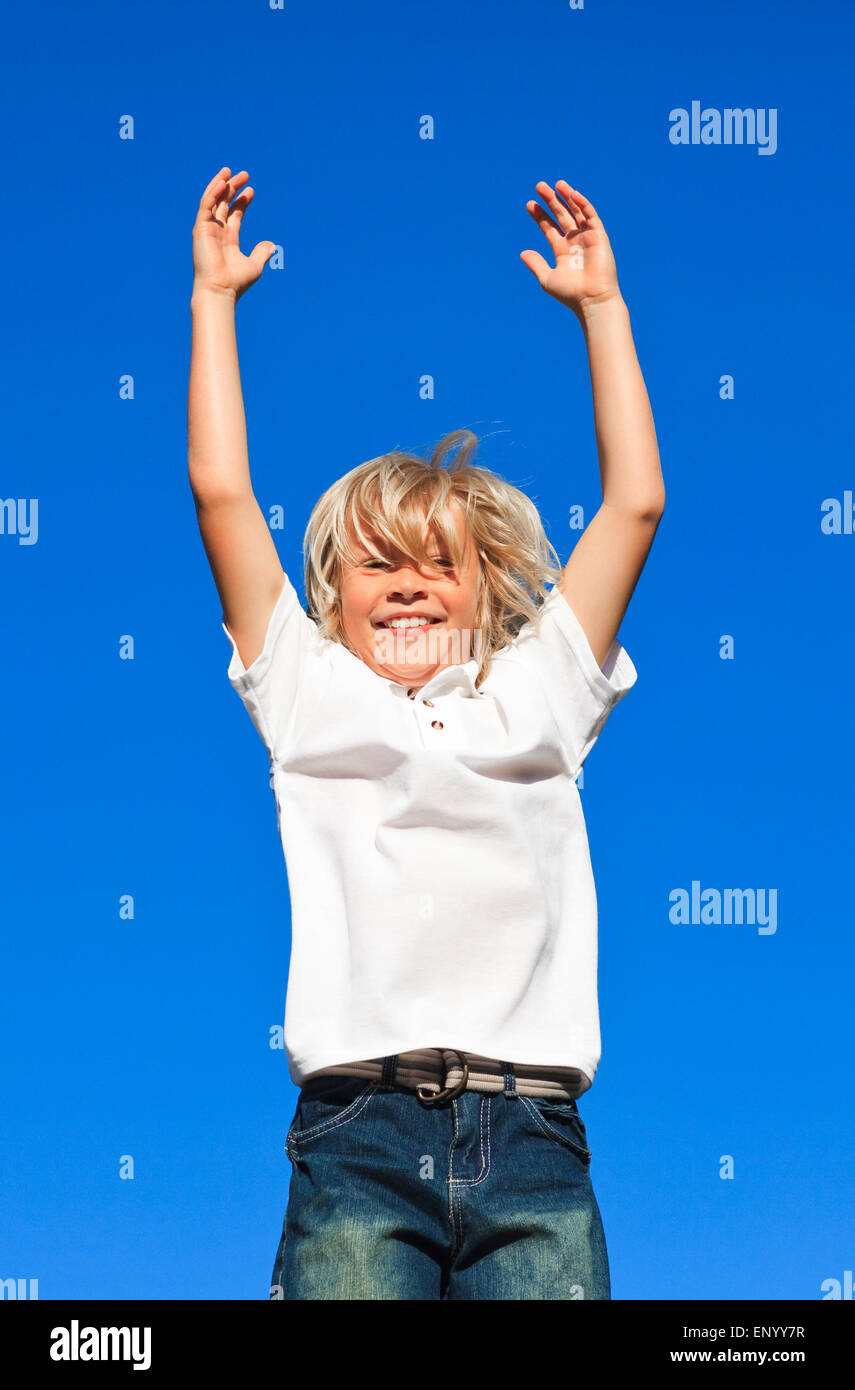Joyful Kid Jumping in the air outdoor Stock Photo - Alamy