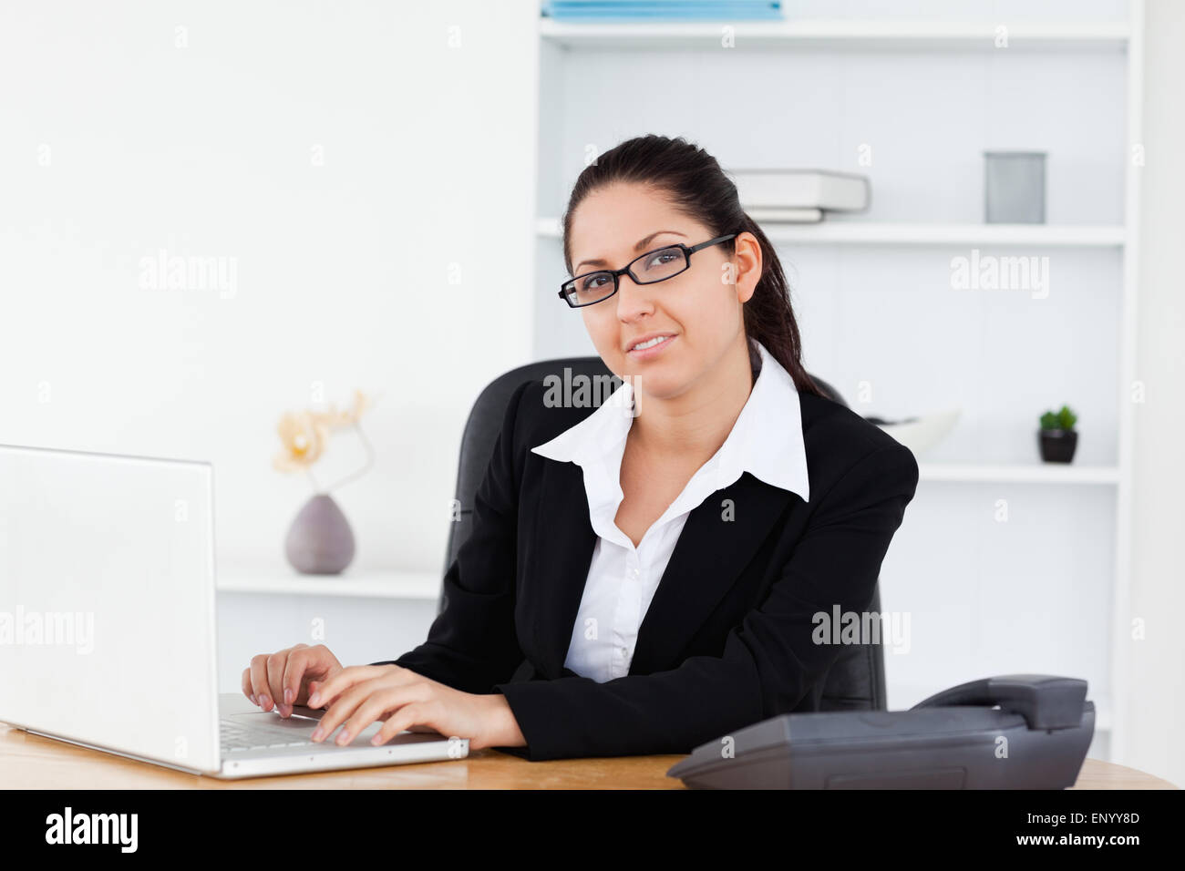 Young businesswoman at workplace Stock Photo - Alamy
