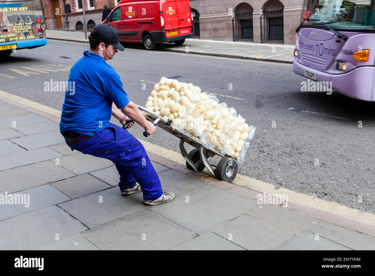 Delivery man delivering potatoes to a restaurant, Nottingham, England, UK Stock Photo
