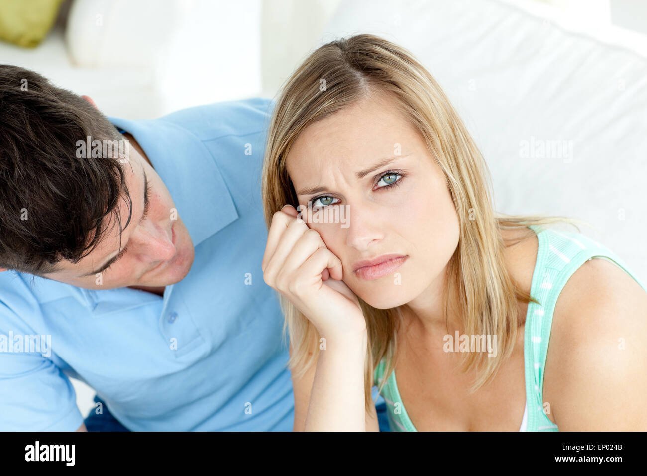 Sad couple having an argue in the living-room Stock Photo - Alamy