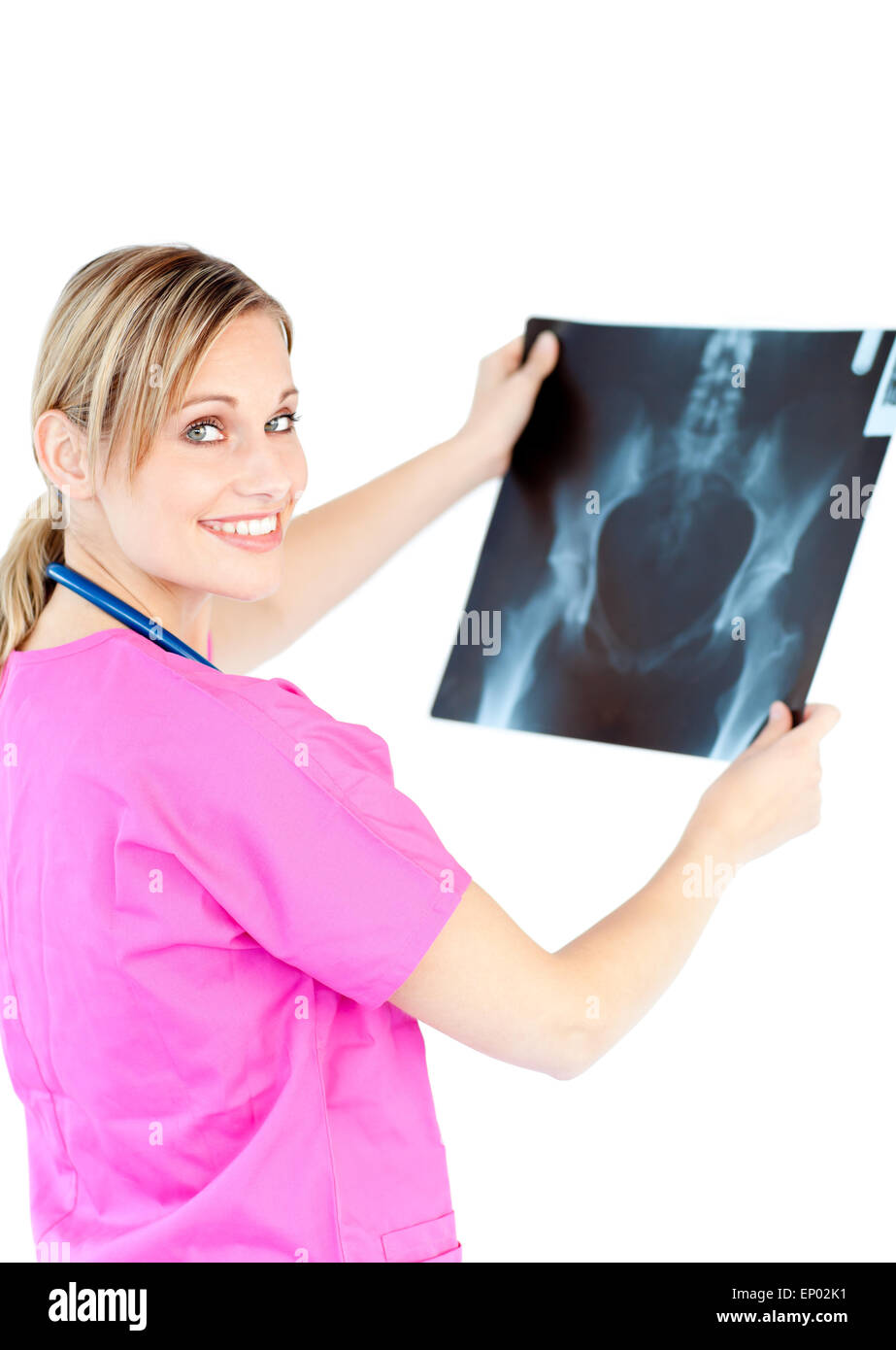 Serious female doctor looking at a x-ray against a white background Stock Photo