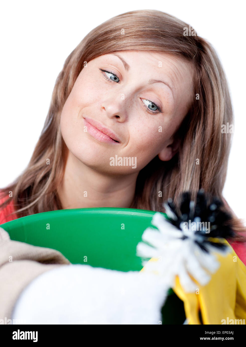 Portrait of a cute woman doing housework against a white background ...