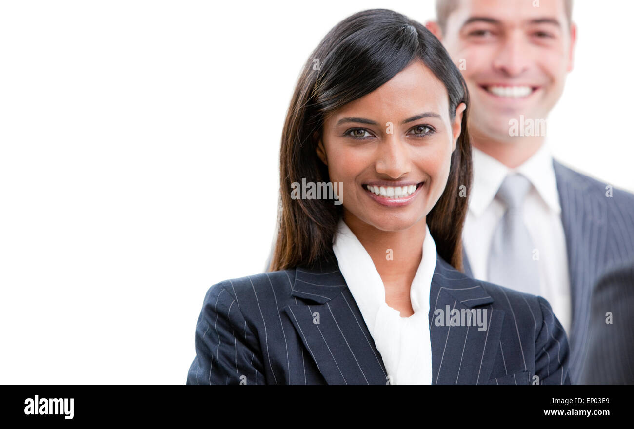 Smiling young business people standing in a row against a white ...