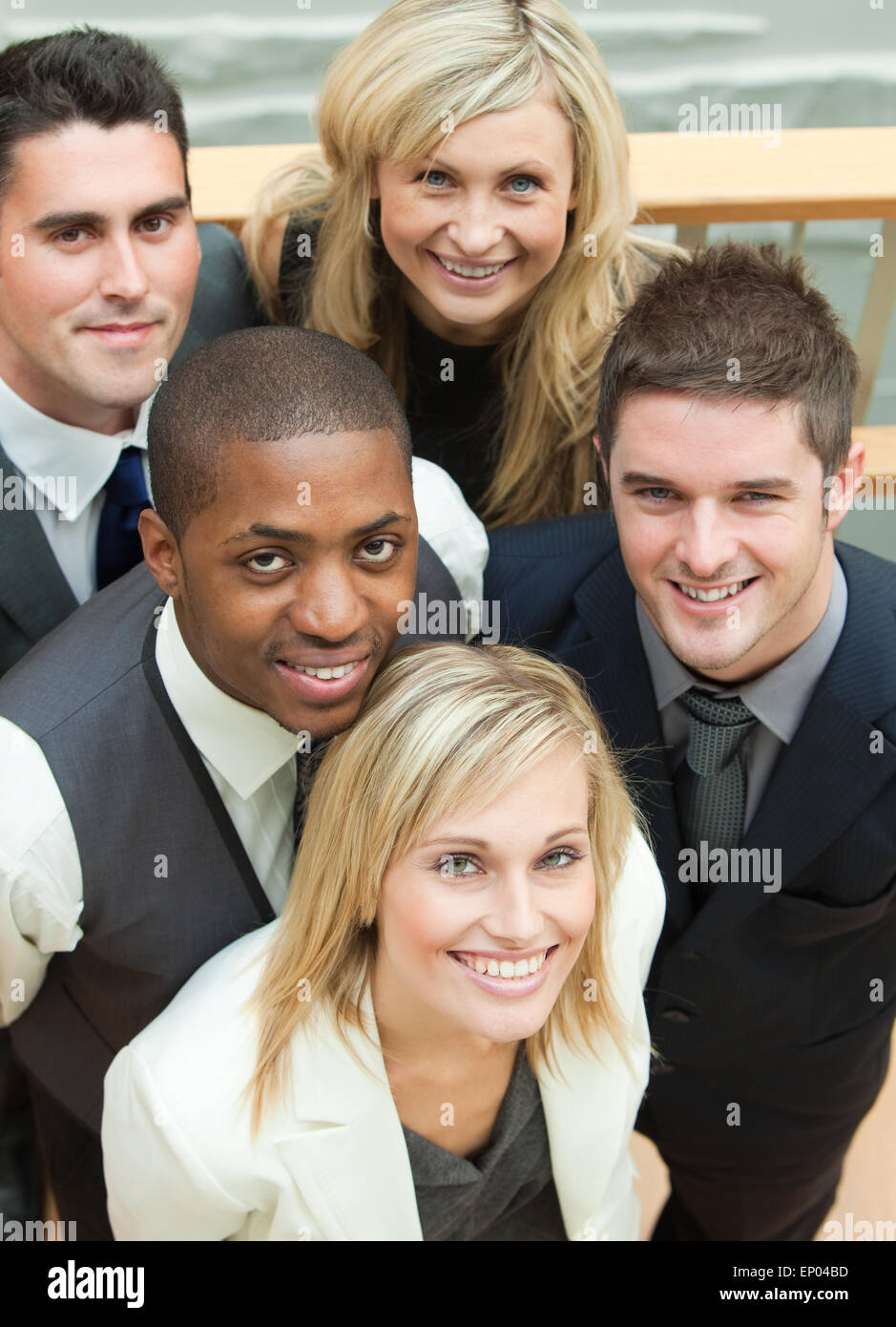 High view of business team smiling at the camera Stock Photo - Alamy