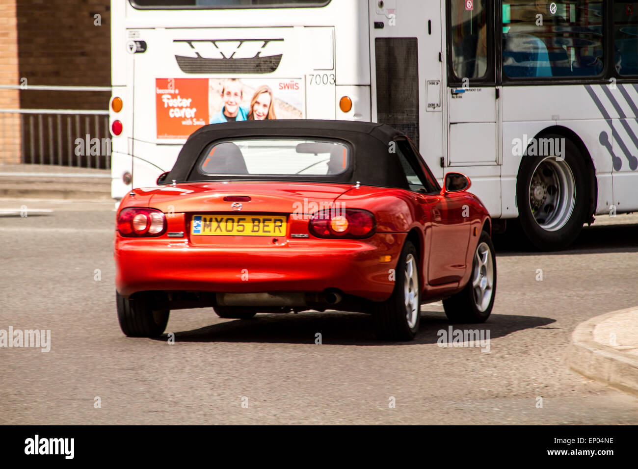 A Mazda Roadster Convertible Sports Car travelling around the West Port Roundabout in Dundee, UK Stock Photo