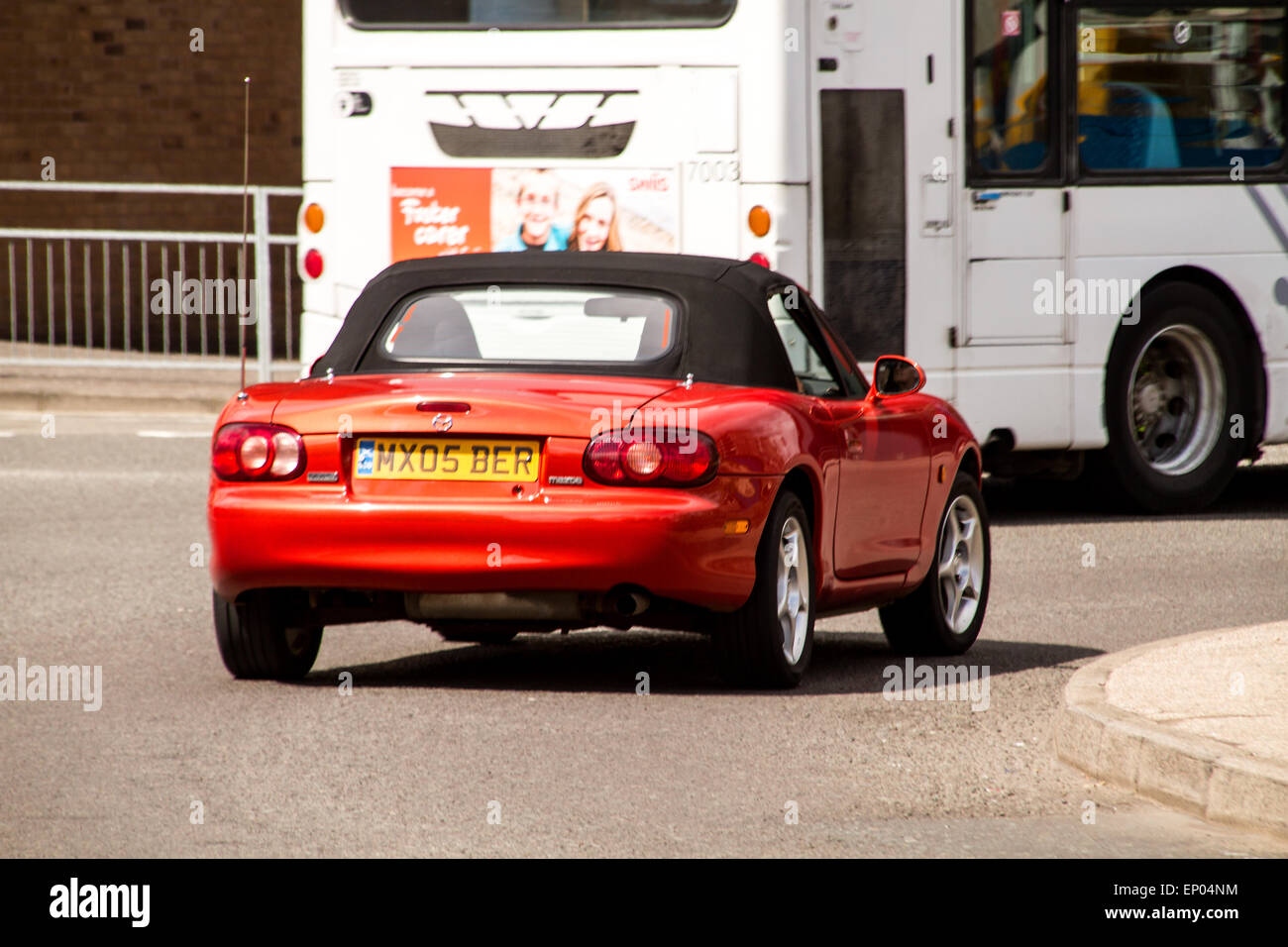 A Mazda Roadster Convertible Sports Car speeding around the West Port Roundabout in Dundee, UK Stock Photo