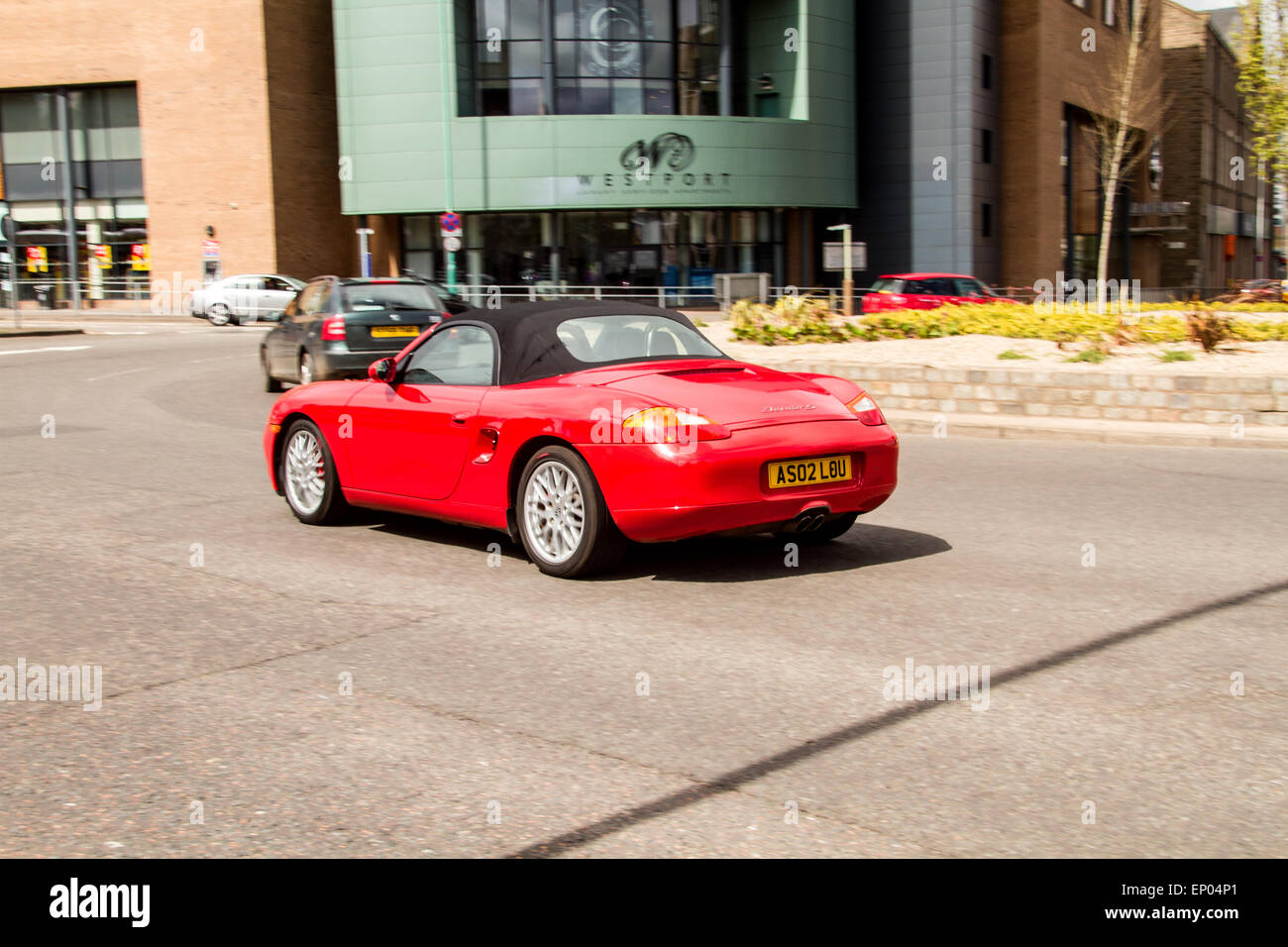 A 1999 Porsche Boxter Convertible Sports Car travelling around the West Port Roundabout in Dundee, UK Stock Photo