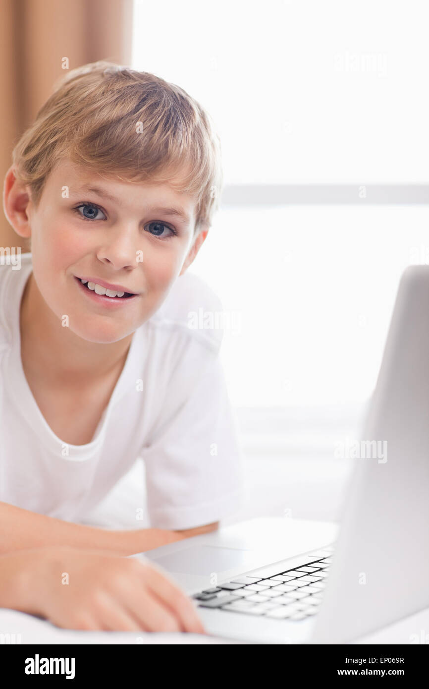 Portrait of a young boy using a laptop Stock Photo - Alamy