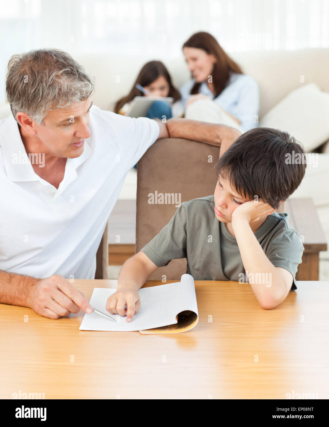 Father helping his son with his homework Stock Photo - Alamy