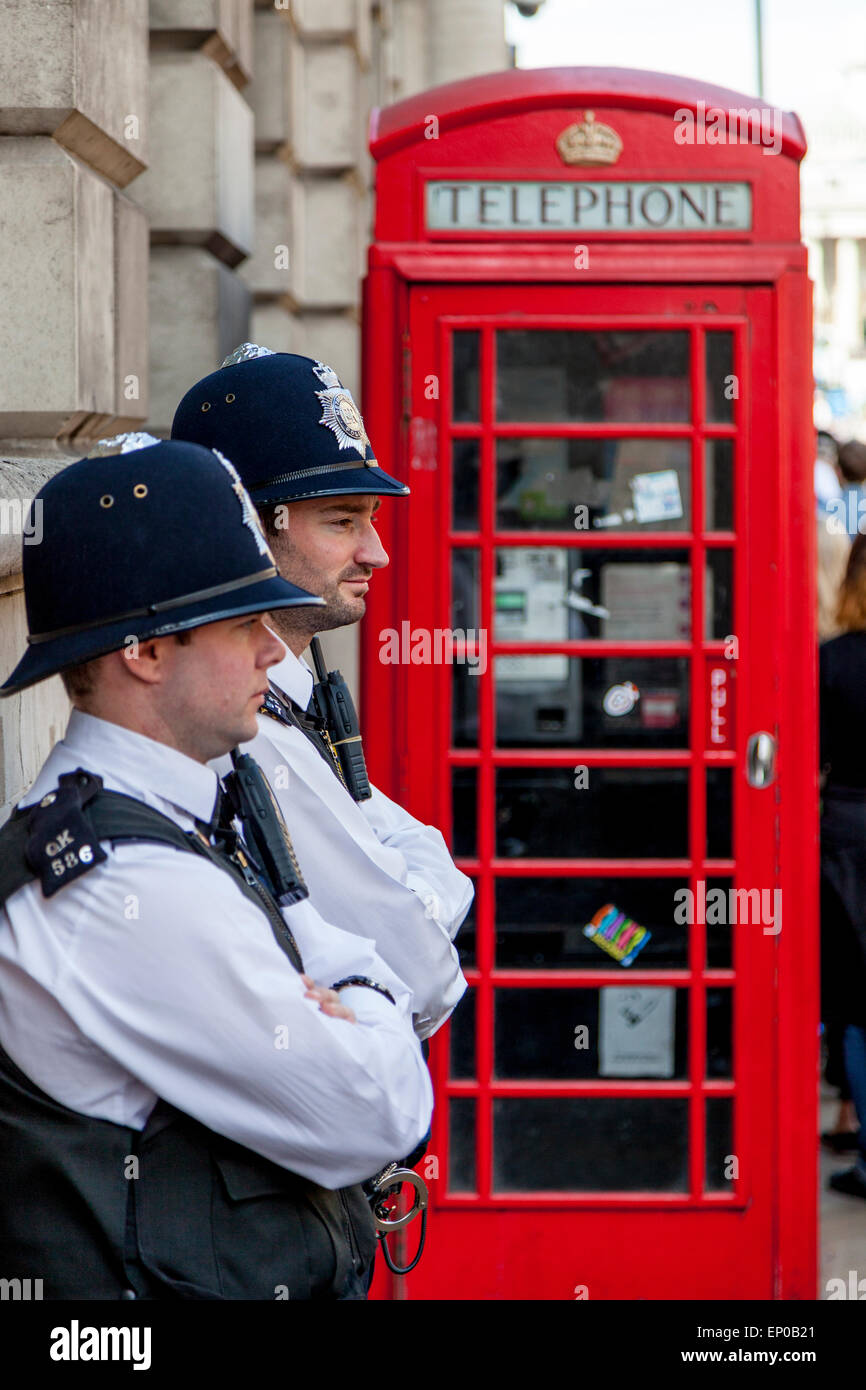 Two Police Officers In Whitehall During The VE day 70th Anniversary Celebrations, London, England Stock Photo