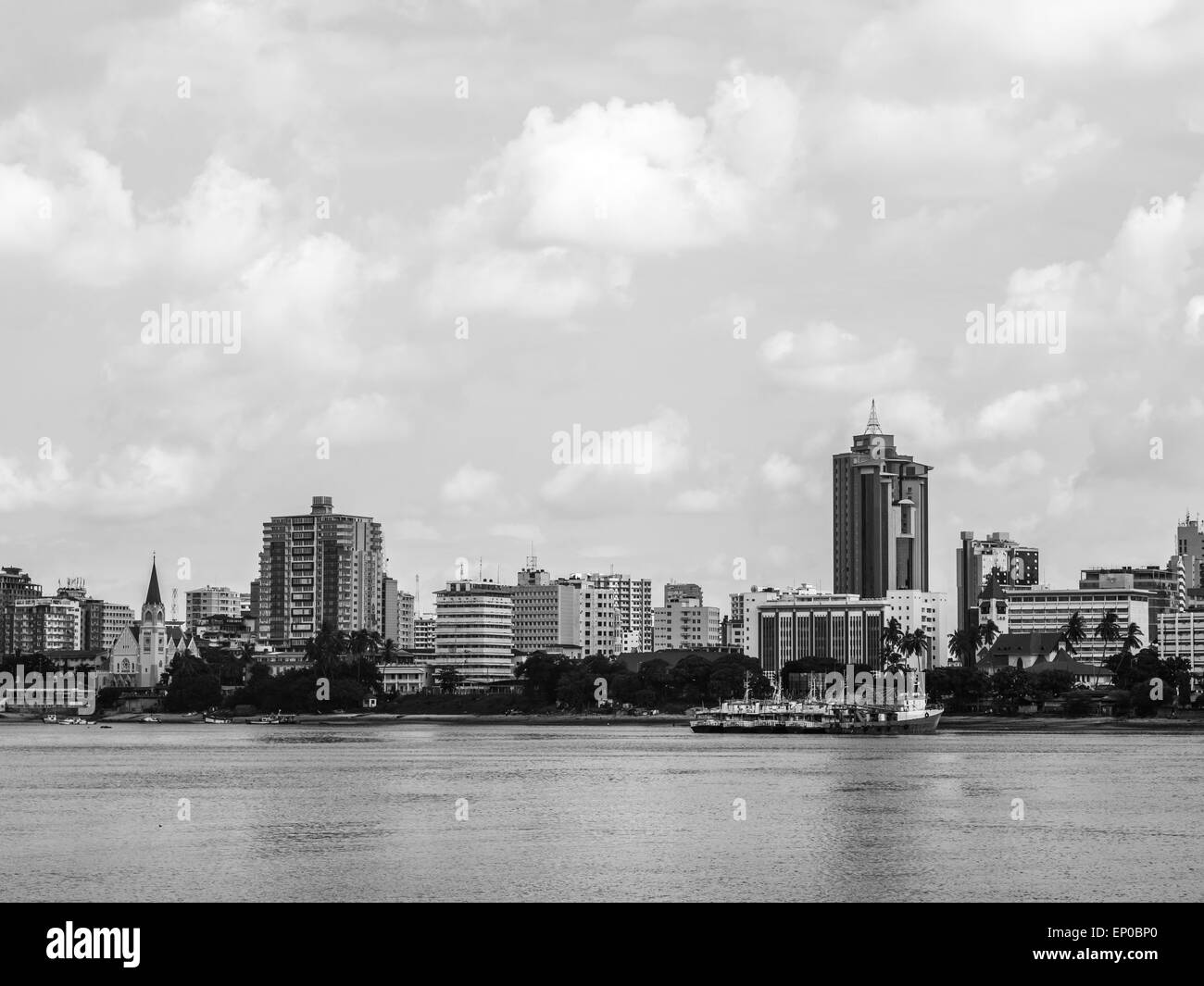 Waterfront of Dar es Salaam, Tanzania in East Africa, with modern architecture, seen from a boat. Horizontal, black and white. Stock Photo