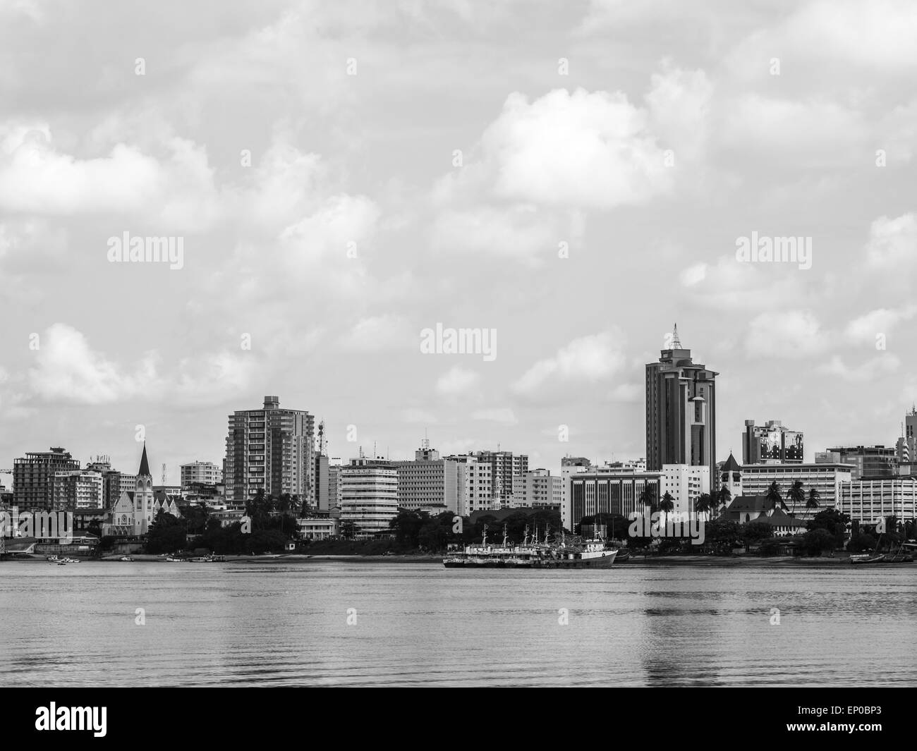 Waterfront of Dar es Salaam, Tanzania in East Africa, with modern architecture, seen from a boat. Horizontal, black and white. Stock Photo