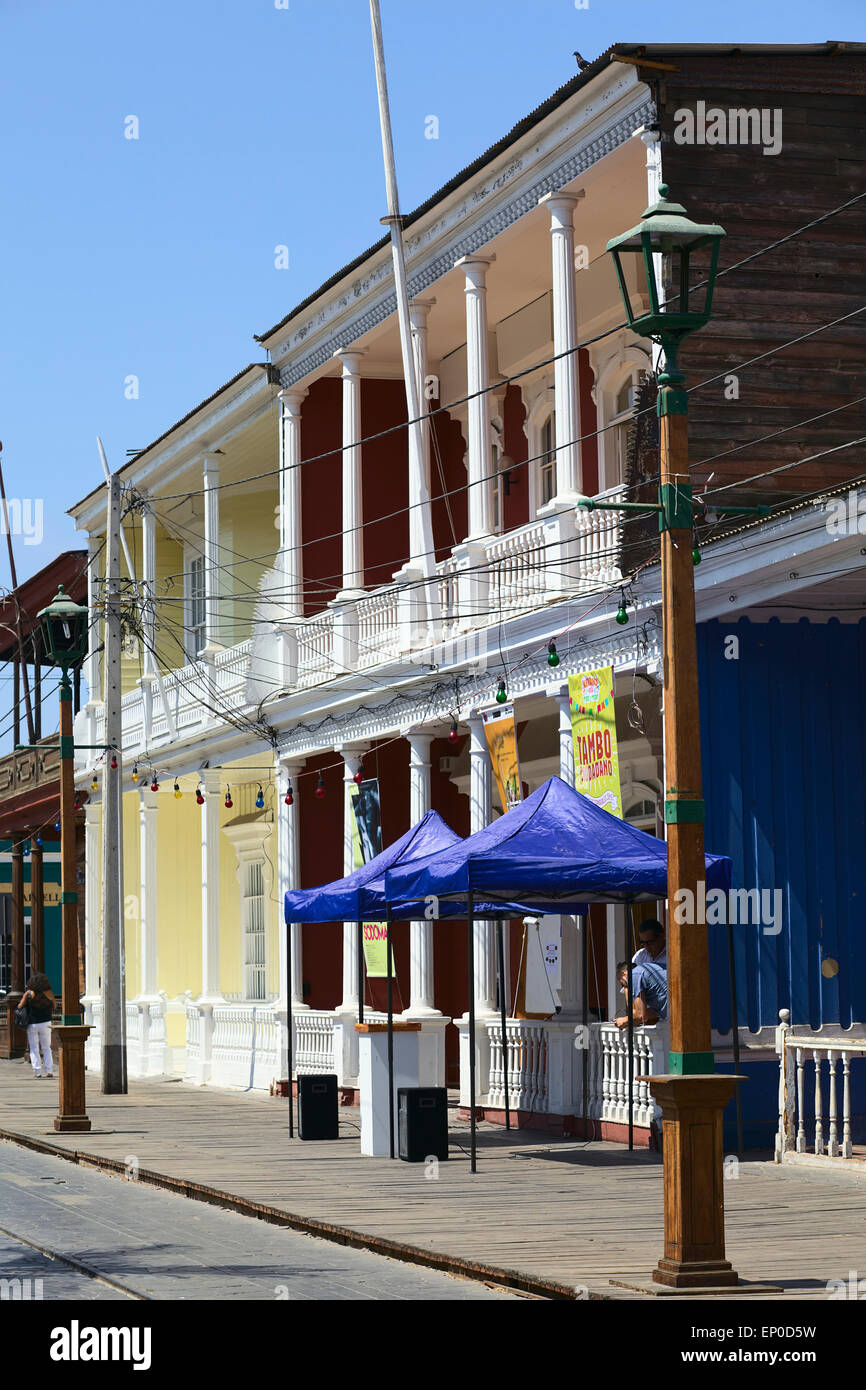 Typical wooden buildings along Baquedano pedestrian boulevard in the city center in Iquique, Chile Stock Photo