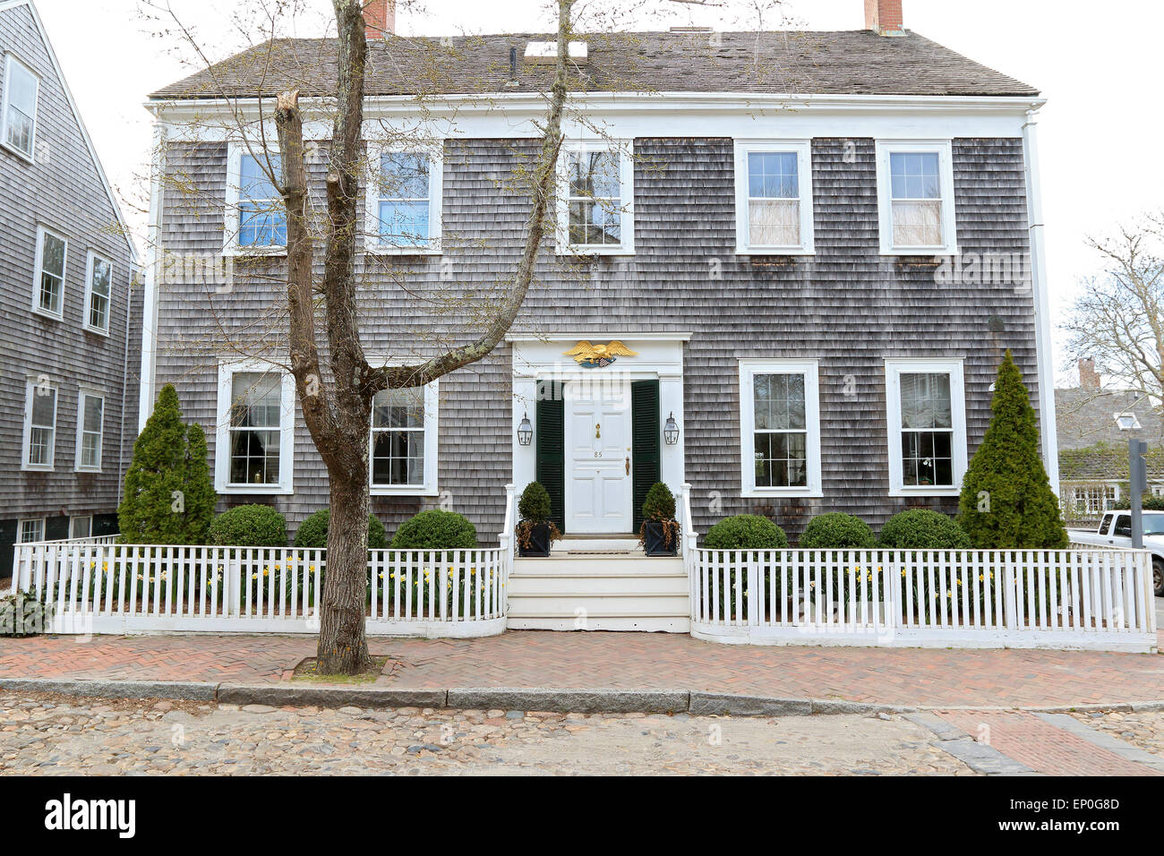 Nantucket Massachusetts on Nantucket Island. Old wooden house near downtown with wooden cedar shingles on cobbled, circa 1725. Stock Photo