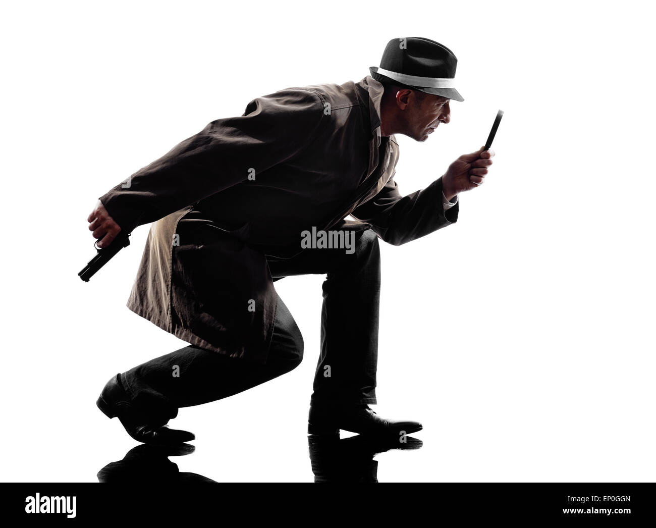 one detective man criminal investigations investigating crime in silhouette on white background Stock Photo