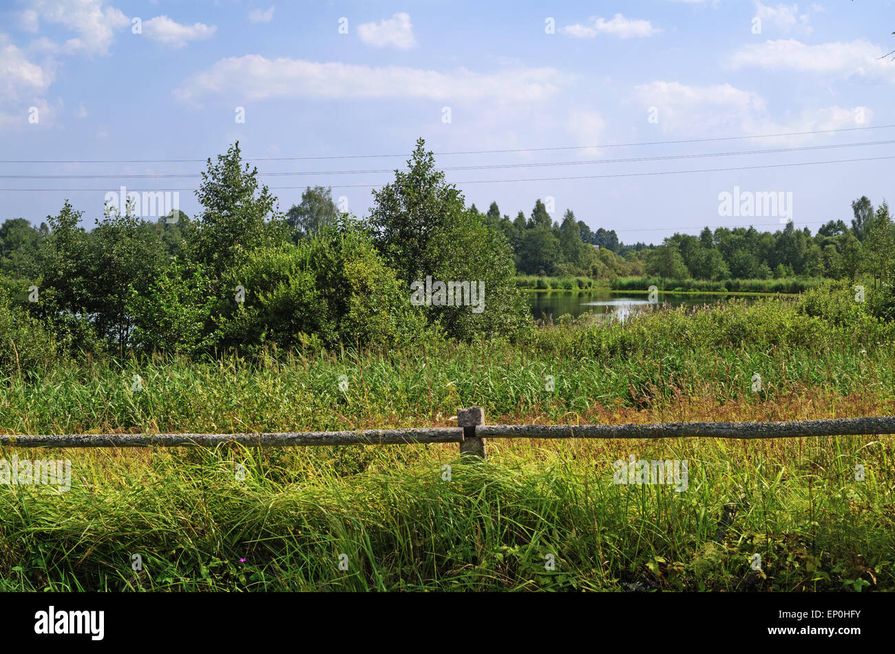 Rural landscape - log fence near lake in village Stock Photo - Alamy