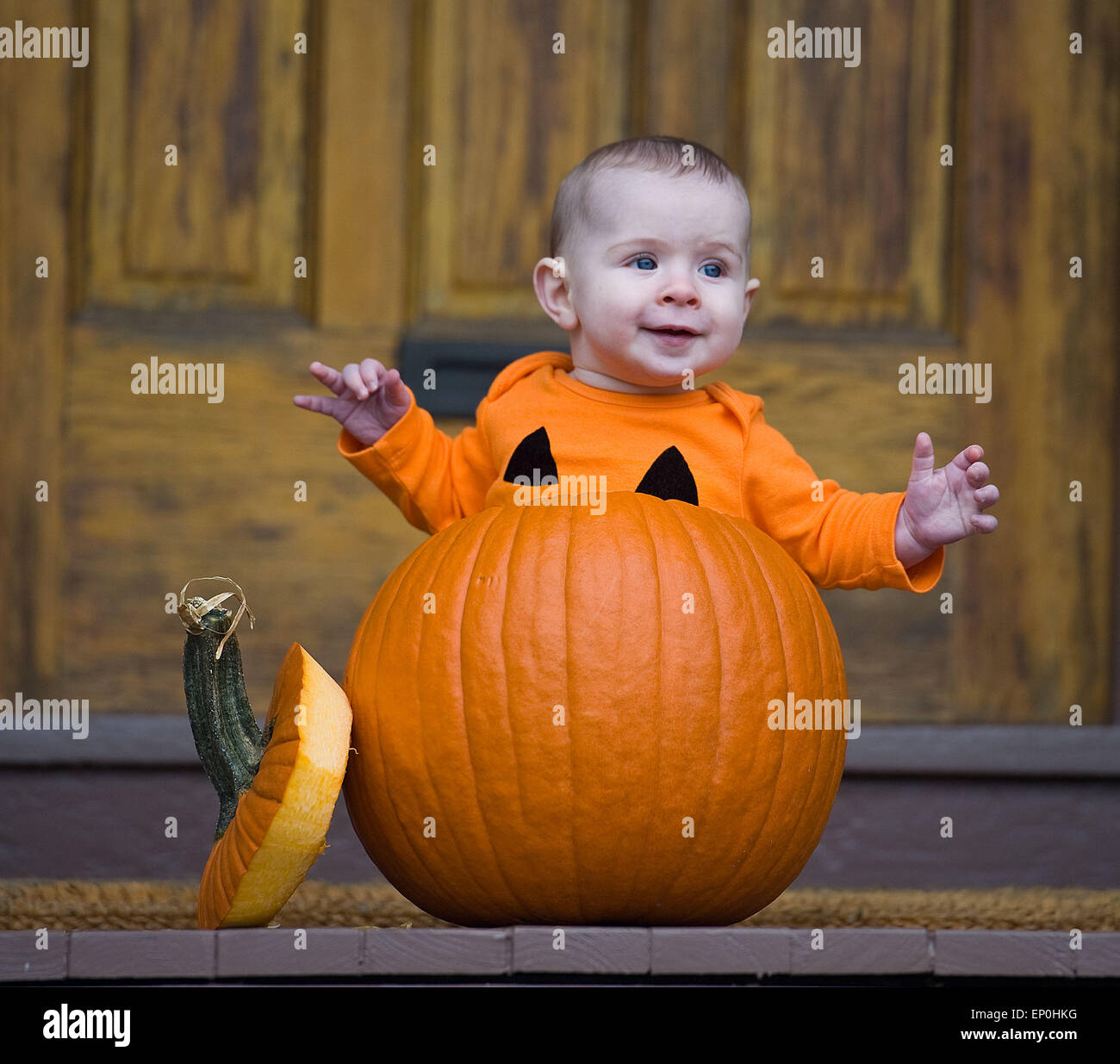Baby boy in a pumpkin Stock Photo