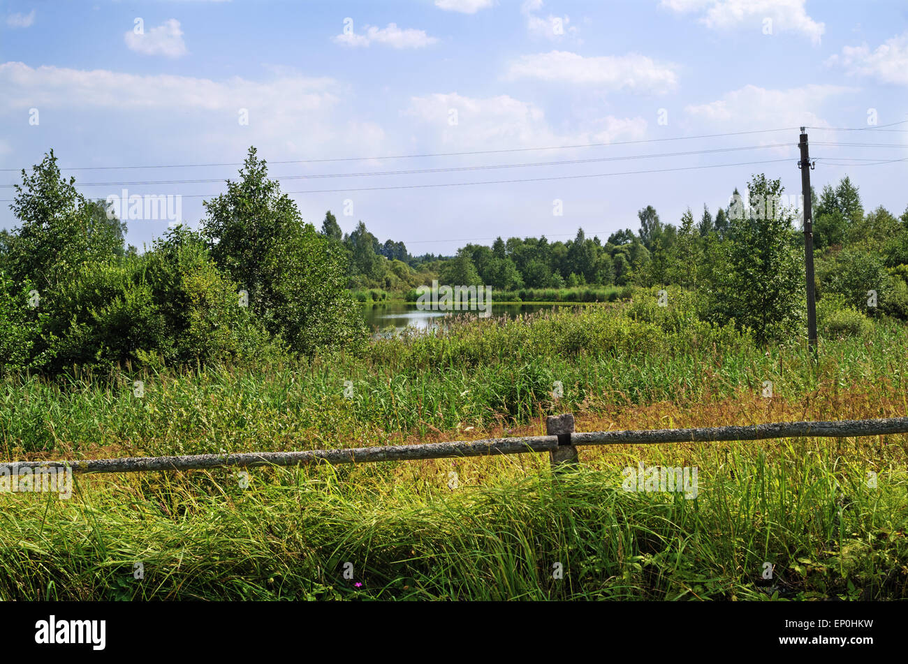 Rural landscape - log fence near lake in village Stock Photo - Alamy