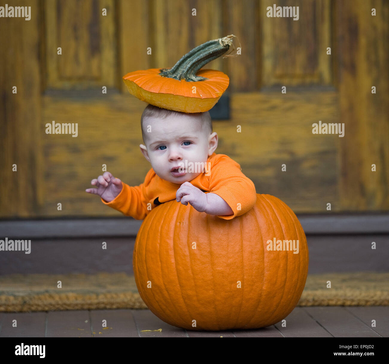 Baby boy in a pumpkin Stock Photo