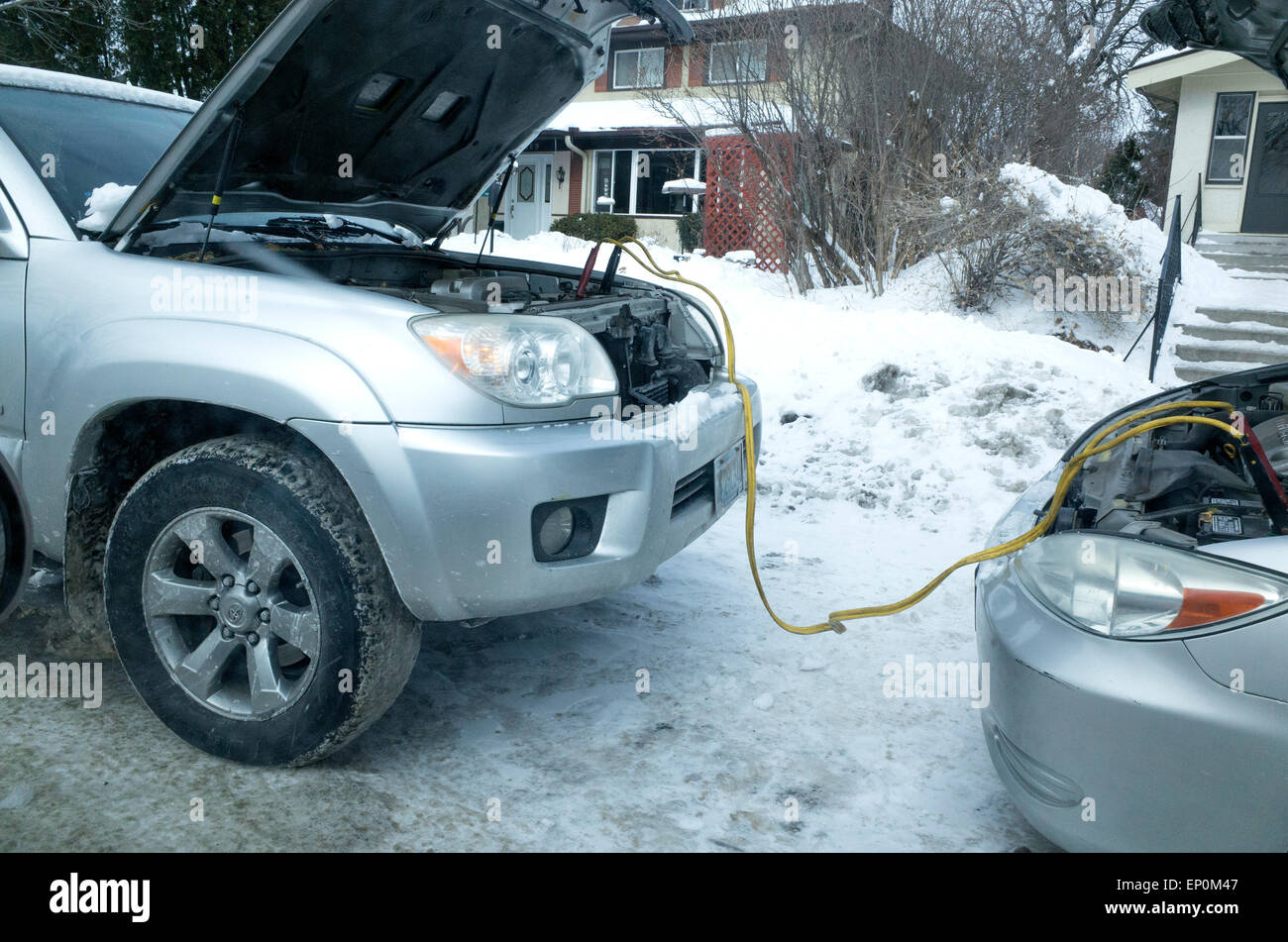 Starting stalled car with jumper cables attached battery to battery