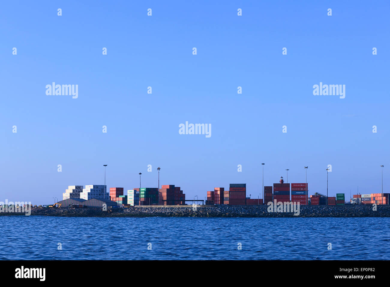Many containers piled in the port in Iquique, Chile. Iquique is a free port city in Northern Chile. Stock Photo