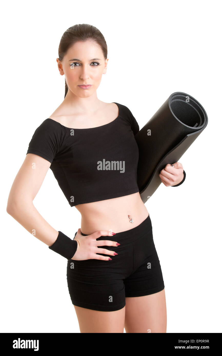 Woman holding a yoga mat, isolated in a white background Stock Photo
