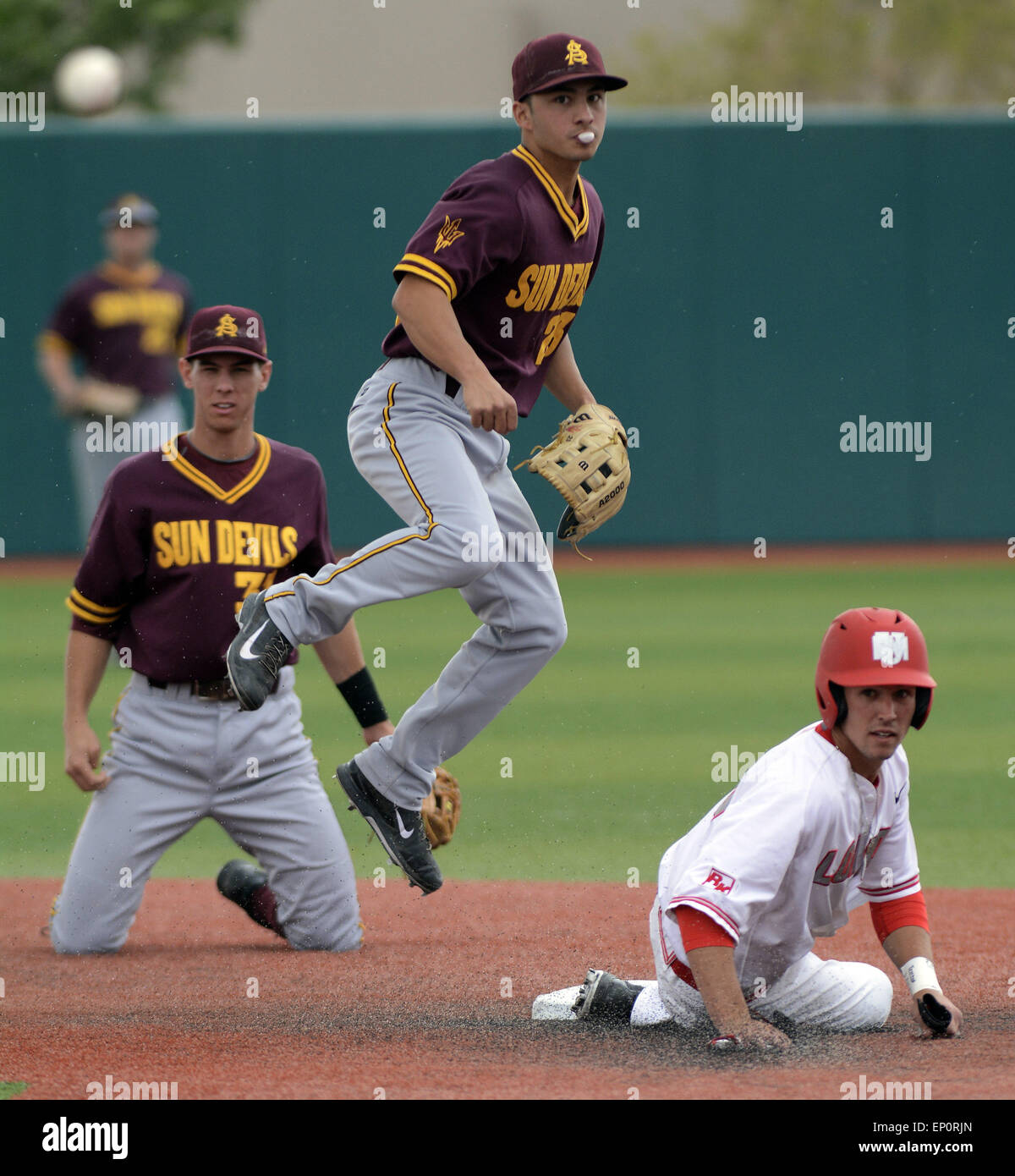 Usa. 12th May, 2015. SPORTS -- The Lobo's Hayden Schilling looks back to first base after Arizona State's Trevor Horn, left, and Jordan Aboites made the play at second base and the double play to first to throw out UNM's Lane Milligan in the third inning of th game at Lobo Field on Tuesday, May 12, 2015. © Greg Sorber/Albuquerque Journal/ZUMA Wire/Alamy Live News Stock Photo