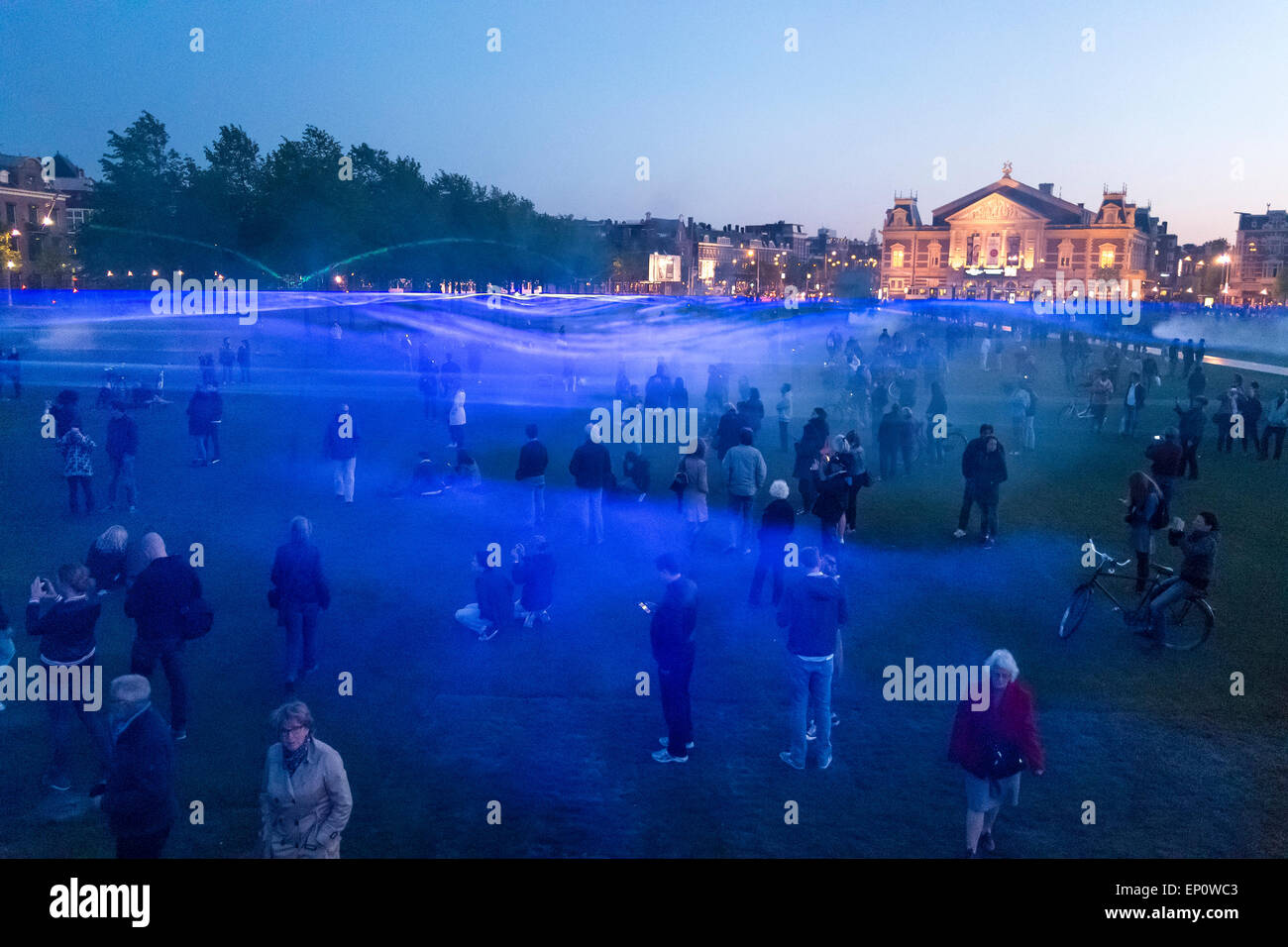 Amsterdam, The Netherlands. 12th May, 2015. What if there were no waterworks in Amsterdam? Dutch designer Daan Rosegaarde who brought us glow in the dark roads and cycle paths, now showed Amsterdam the real water level in the Museum Square between the Rijksmuseum and the Concertgebouw without the dams the pumps and the dikes. It's the run-up to the renovation of the first of the great dams of the Netherlands: the Afsluitdijk (1927-1933) (English: Closure Dike) in the North of the country. Stock Photo