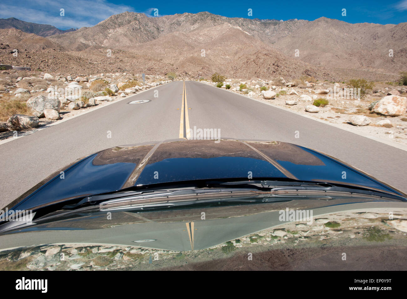 Front of car and middle of a road near Palm Springs, California Stock Photo