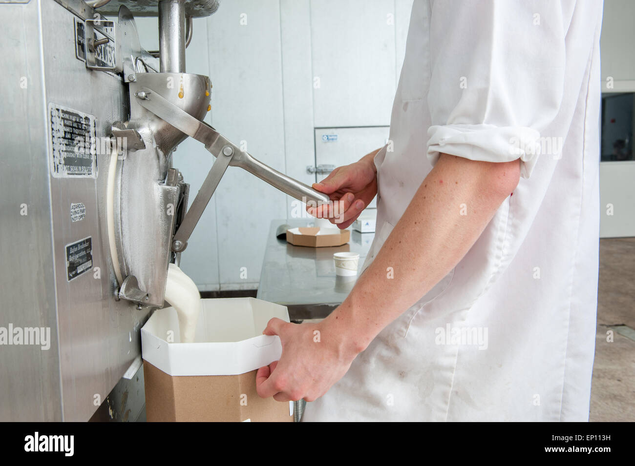 Pouring ice cream into a container in Baltimore, Maryland, USA Stock Photo