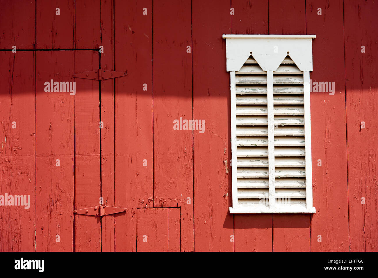 White wooden shutters on red barn in Westminster, Maryland, USA Stock Photo