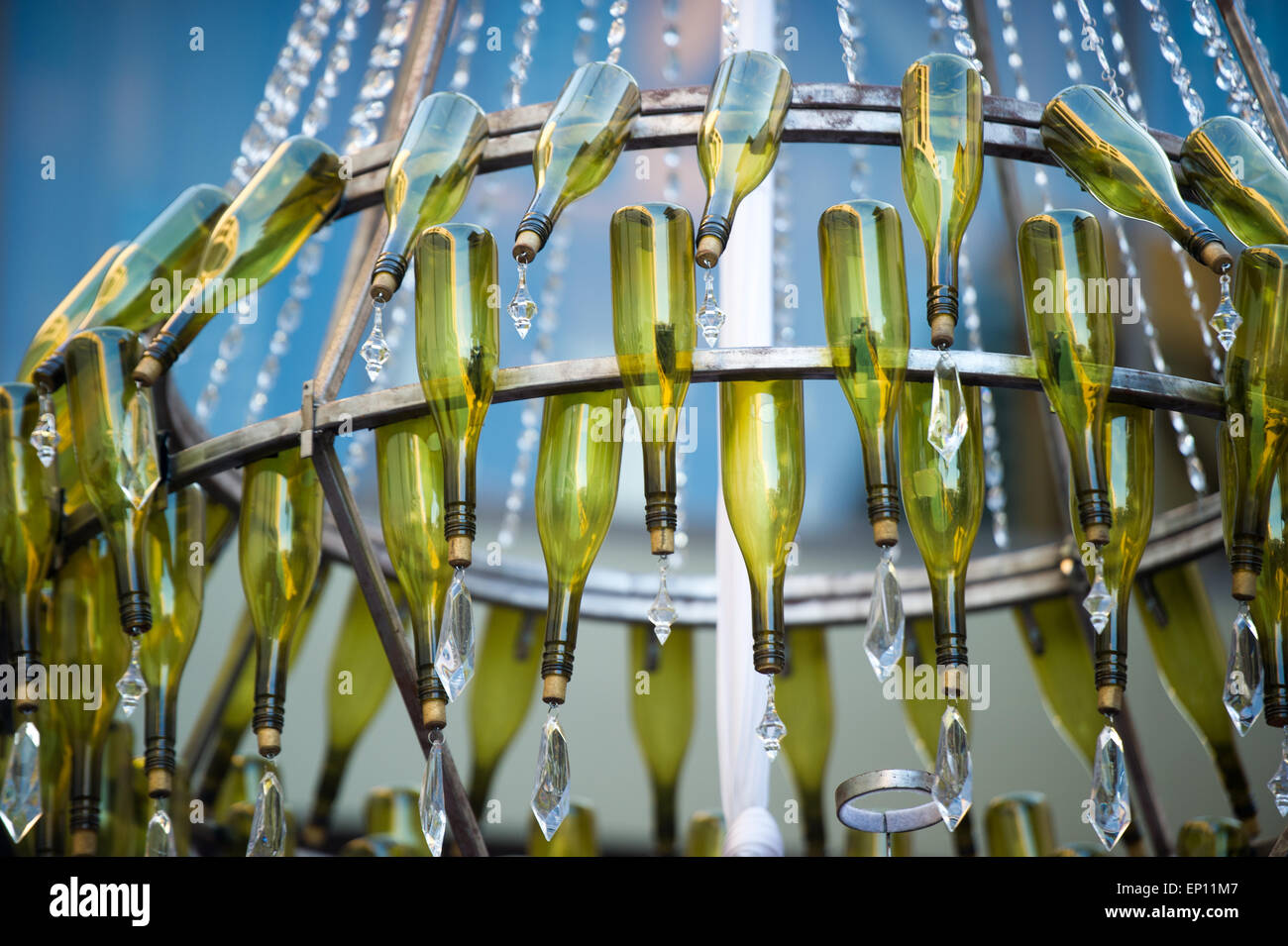Chandelier made of green wine bottles. Stock Photo