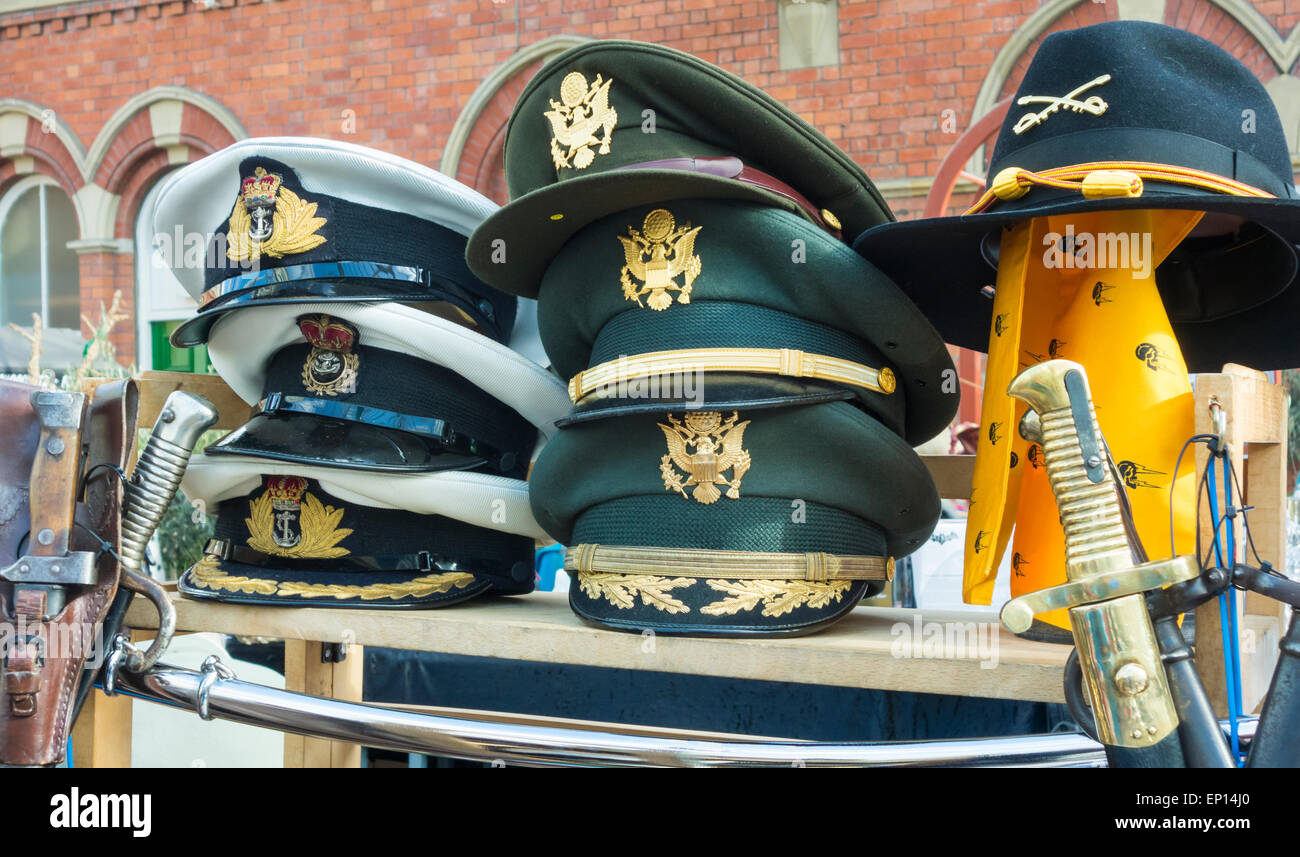 Military hats on market stall at Tynemouth weekend market in Tynemouth Metro station. Tynemouth, north east England. UK Stock Photo